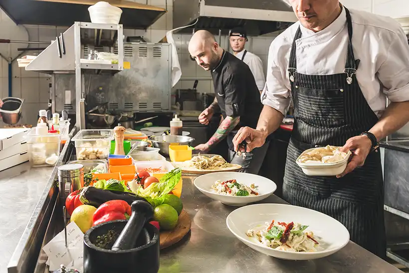 Chefs cooking in a restaurant kitchen